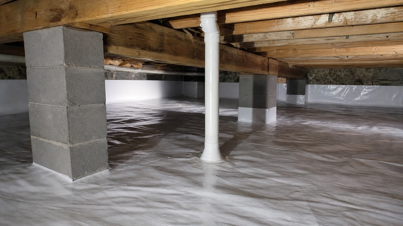 Crawlspace radon membrane and suction pipe in an Asheville home